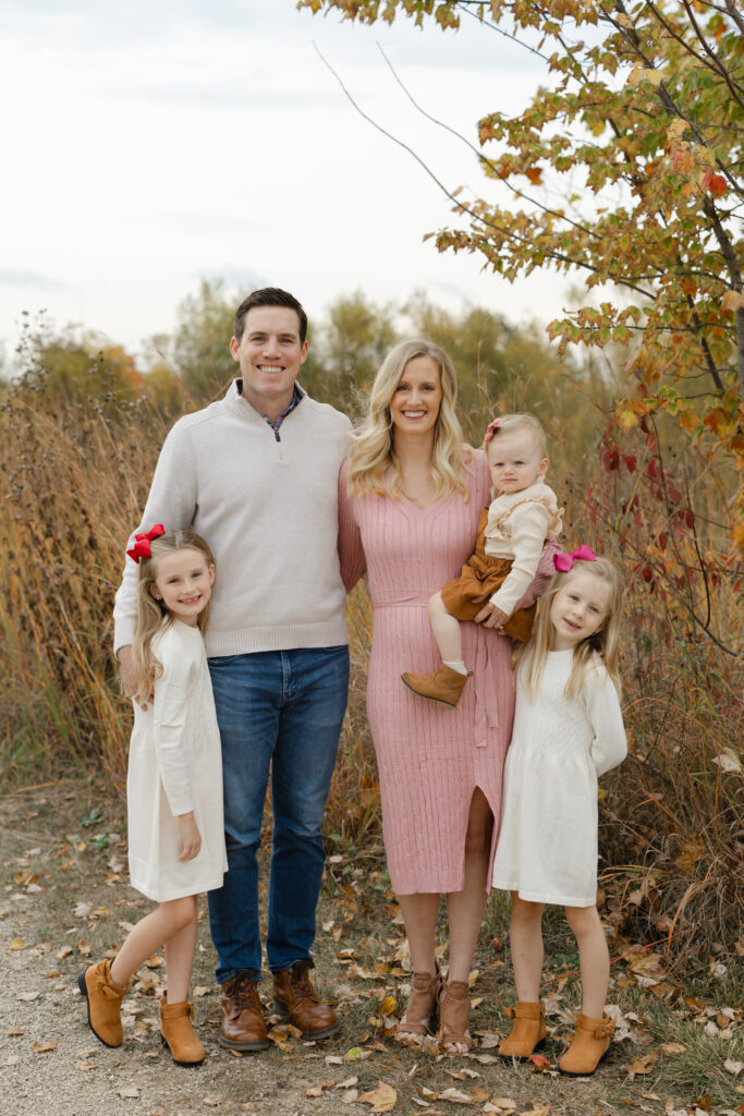 Family smiling during Fall Mini Sessions at West Park with Capturing Simplicity Photography