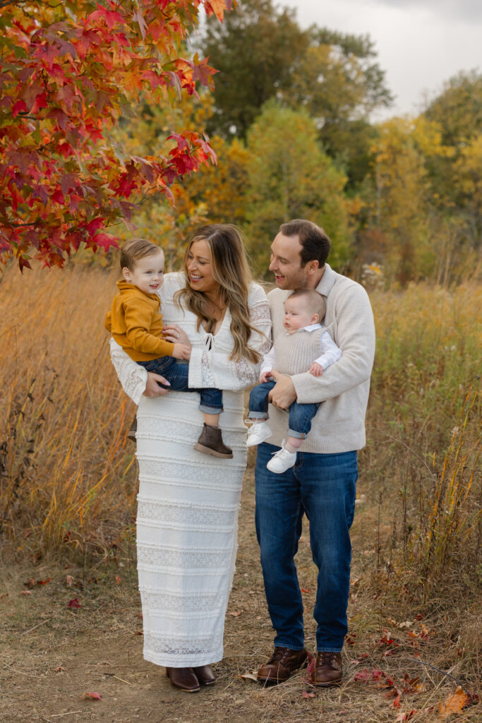Family giggling during Fall Mini Sessions at West Park with Capturing Simplicity Photography