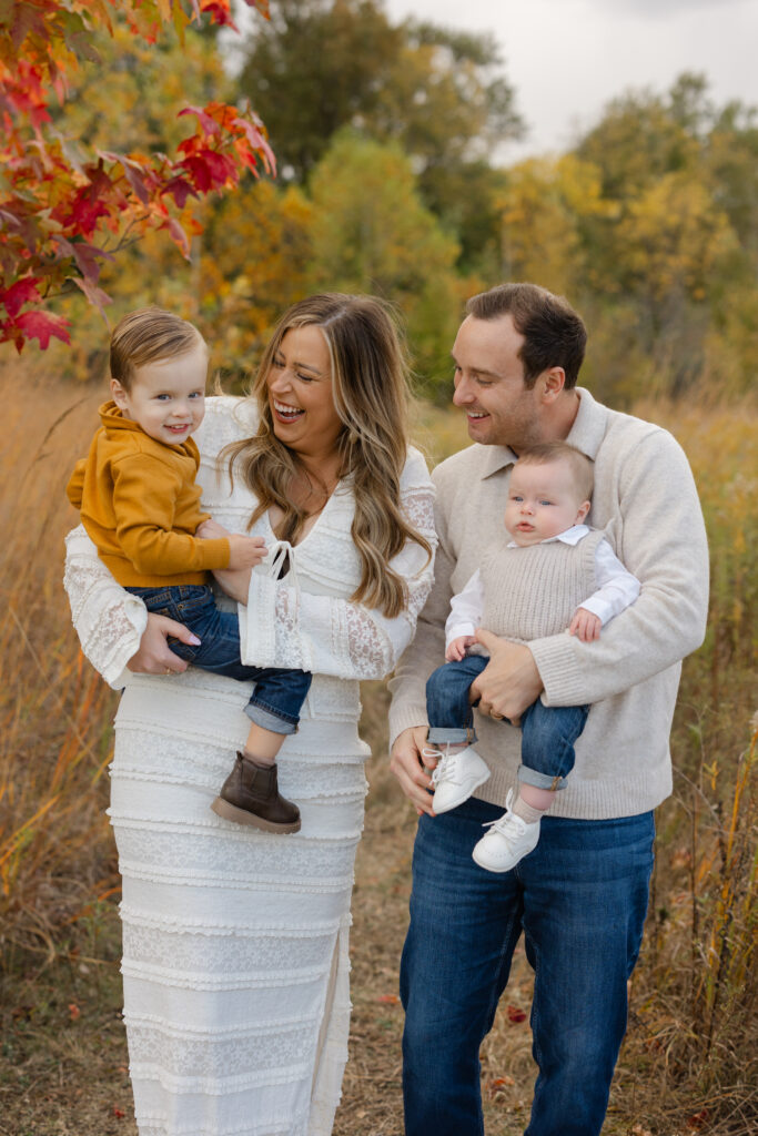 Family laughing and giggling during Fall Mini Sessions at West Park with Capturing Simplicity Photography