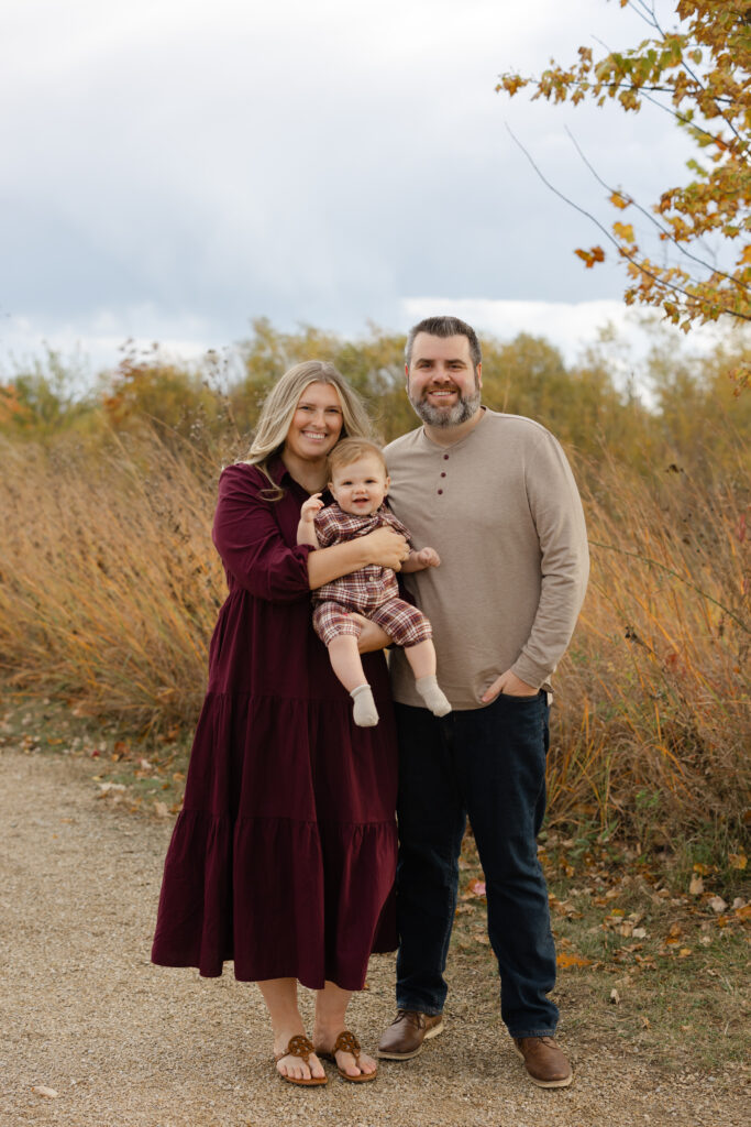 Family smiling during Fall Mini Sessions at West Park with Capturing Simplicity Photography
