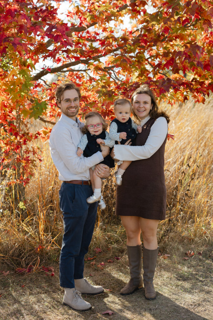 Family smiling during Fall Mini Sessions at West Park with Capturing Simplicity Photography