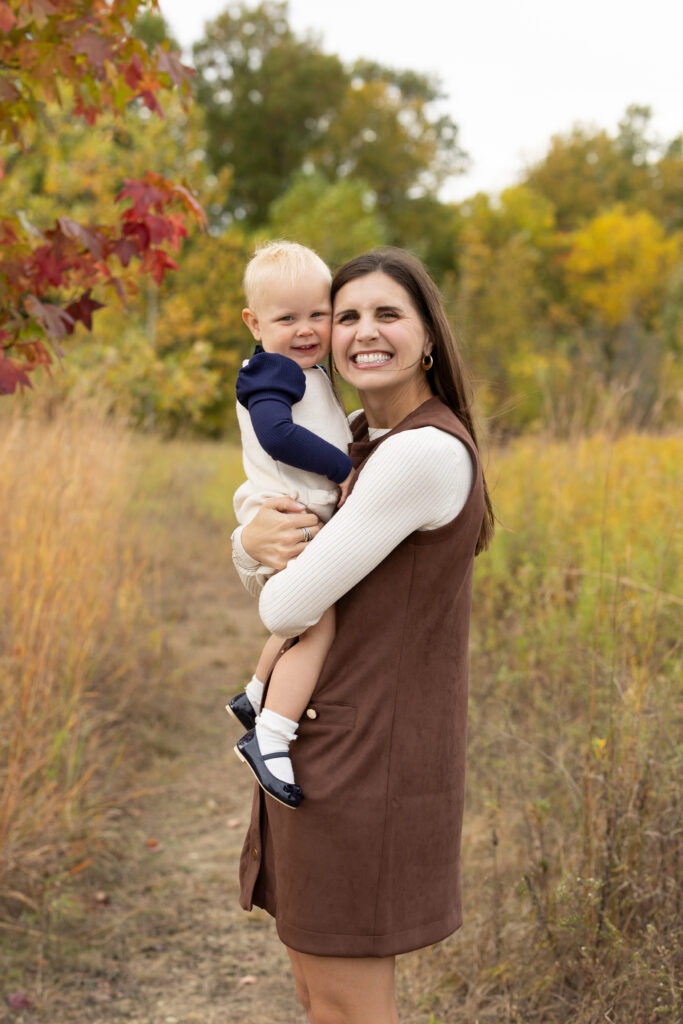 Mom snuggling daughter during Fall Mini Sessions at West Park with Capturing Simplicity Photography