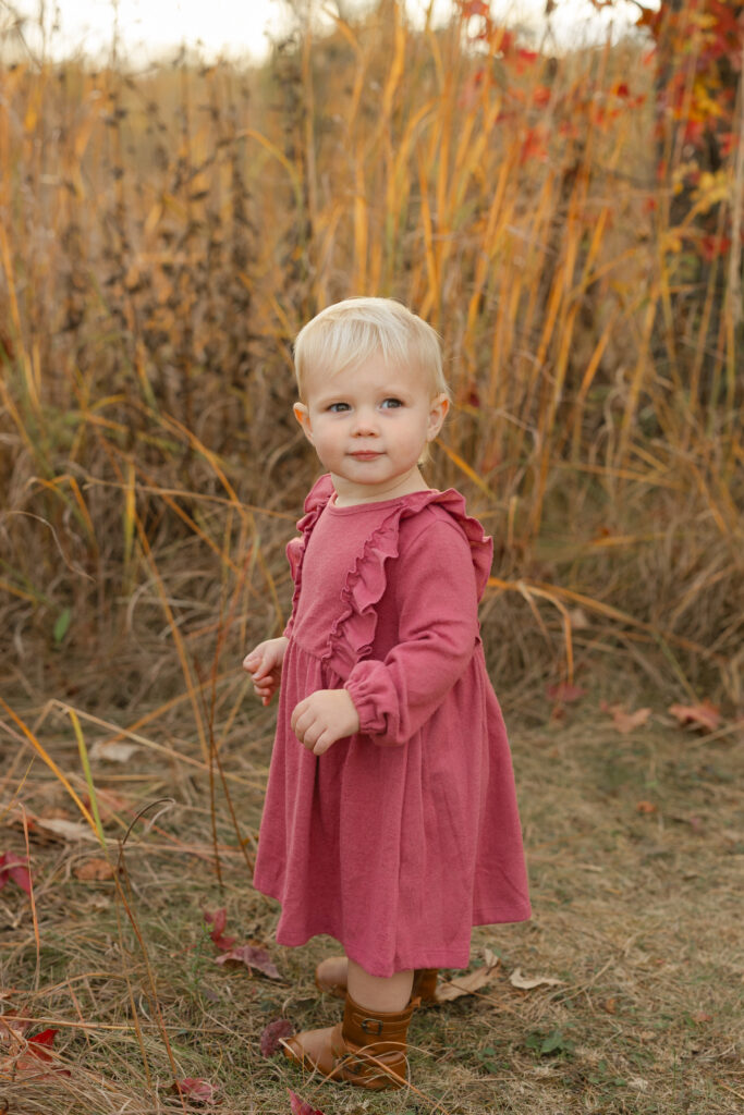 little girl looking to mom during Fall Mini Sessions at West Park with Capturing Simplicity Photography