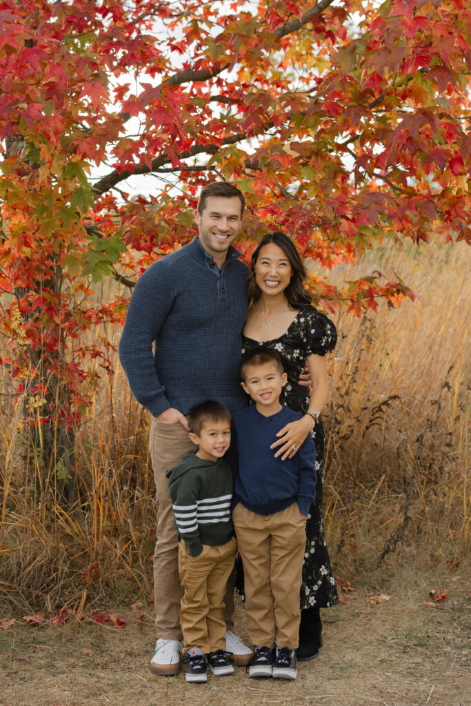 Family smiling during Fall Mini Sessions at West Park with Capturing Simplicity Photography