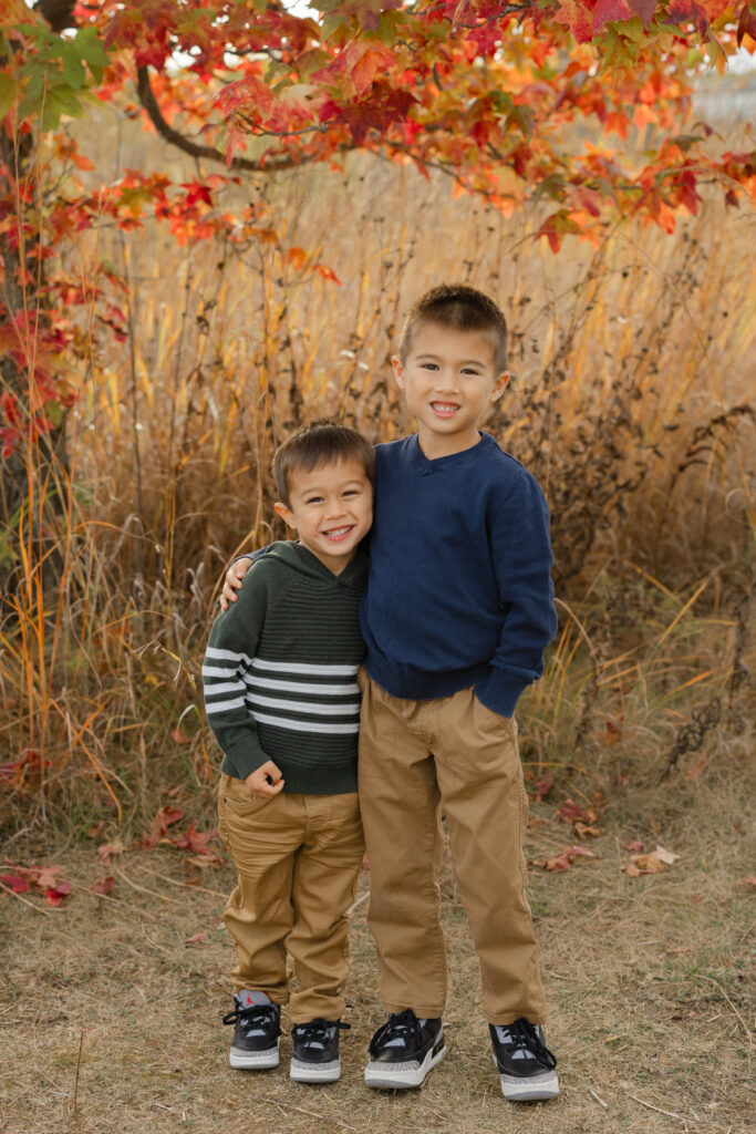 Brothers smiling during Fall Mini Sessions at West Park with Capturing Simplicity Photography