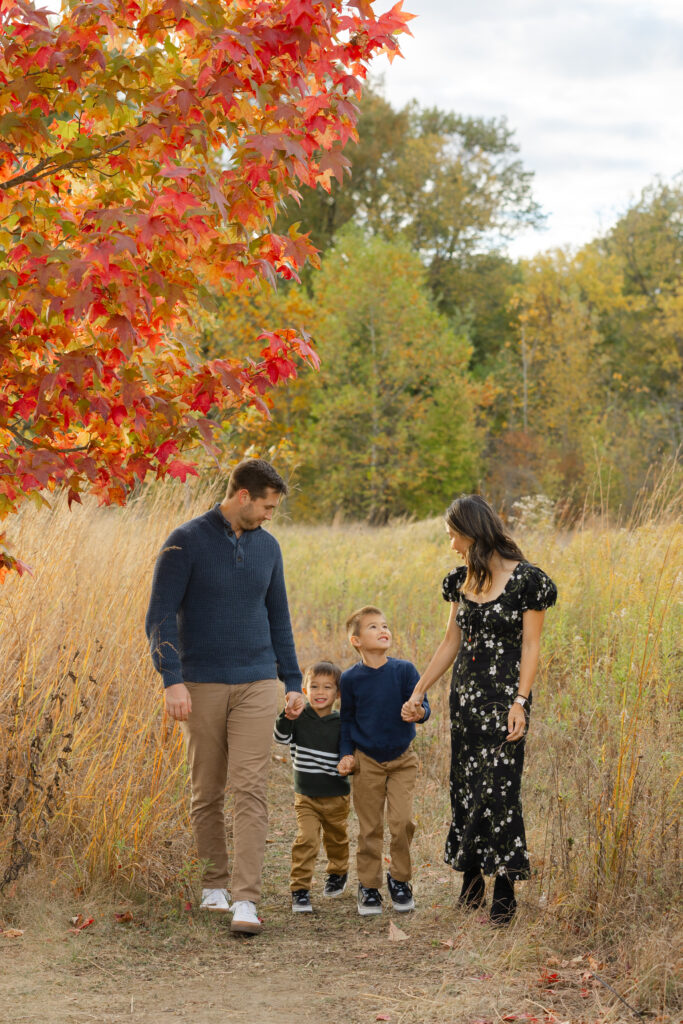Family walking on path during Fall Mini Sessions at West Park with Capturing Simplicity Photography