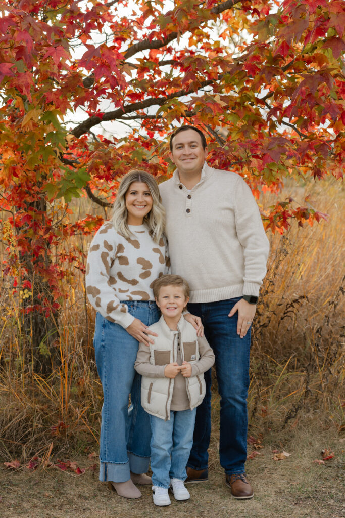 Family smiling during Fall Mini Sessions at West Park with Capturing Simplicity Photography