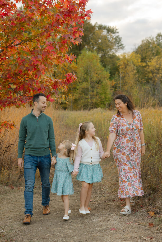 Family walking during Fall Mini Sessions at West Park with Capturing Simplicity Photography