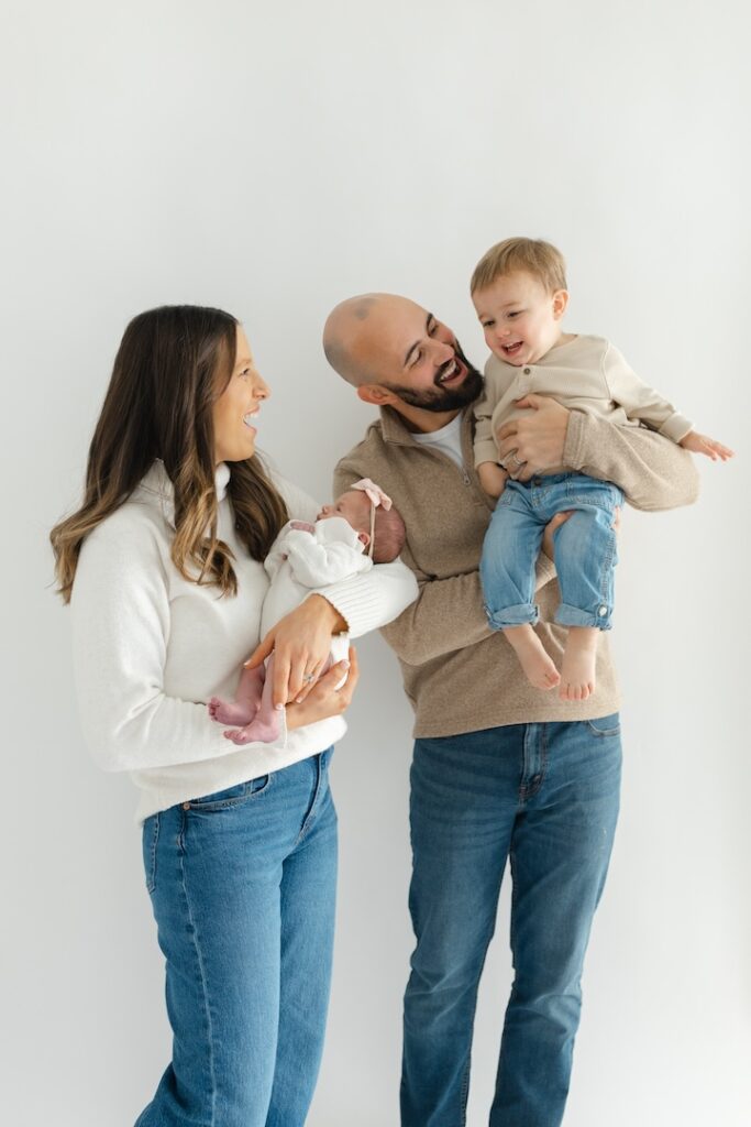 Joyful family photos at Aspiring Eden Studio during newborn photos with Indianapolis Newborn Photographer Capturing Simplicity Photography