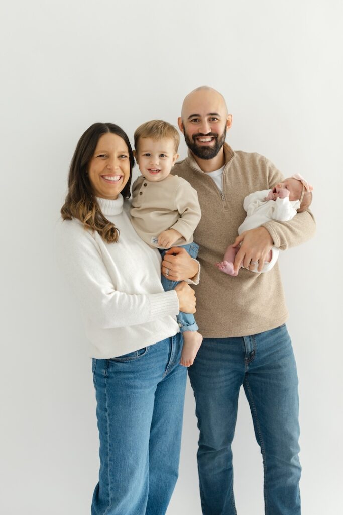 Family smiling during newborn photos with Indianapolis Newborn Photographer Capturing Simplicity Photography