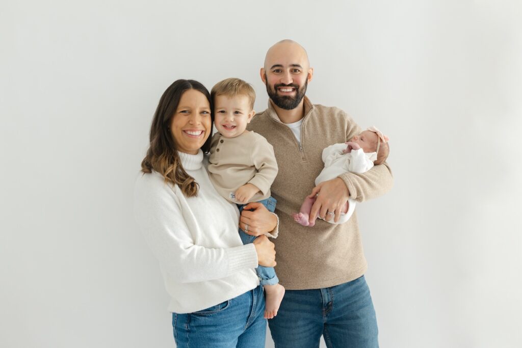 Family smiling during newborn photos with Indianapolis Newborn Photographer Capturing Simplicity Photography