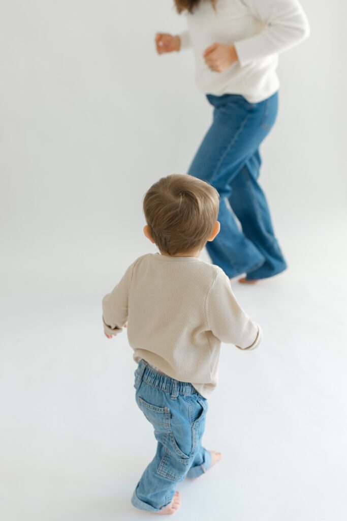 Mom and son playing tag during newborn photos with Indianapolis Newborn Photographer Capturing Simplicity Photography