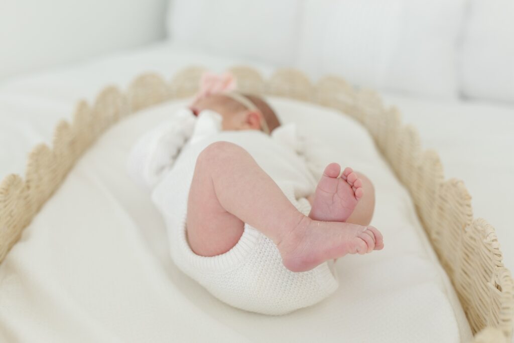 Snuggled infant with little feet during newborn photos with Indianapolis Newborn Photographer Capturing Simplicity Photography