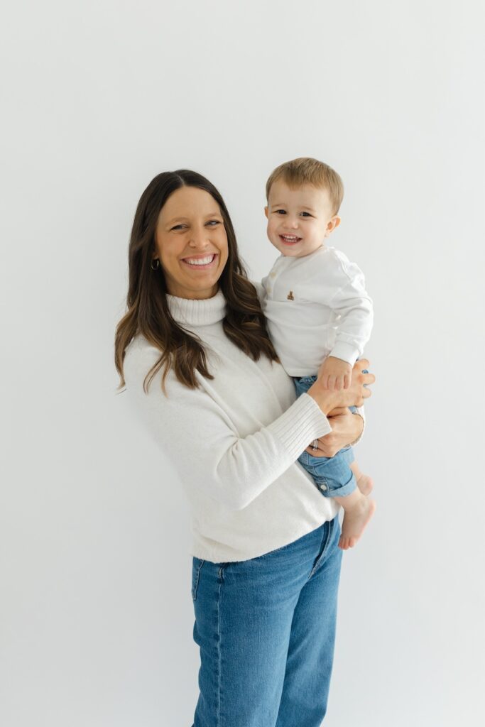 Mom and son smiling during newborn photos with Indianapolis Newborn Photographer Capturing Simplicity Photography